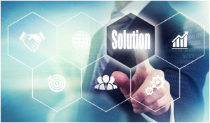 Image of business person pointing to the word "Solution" on a clear screen